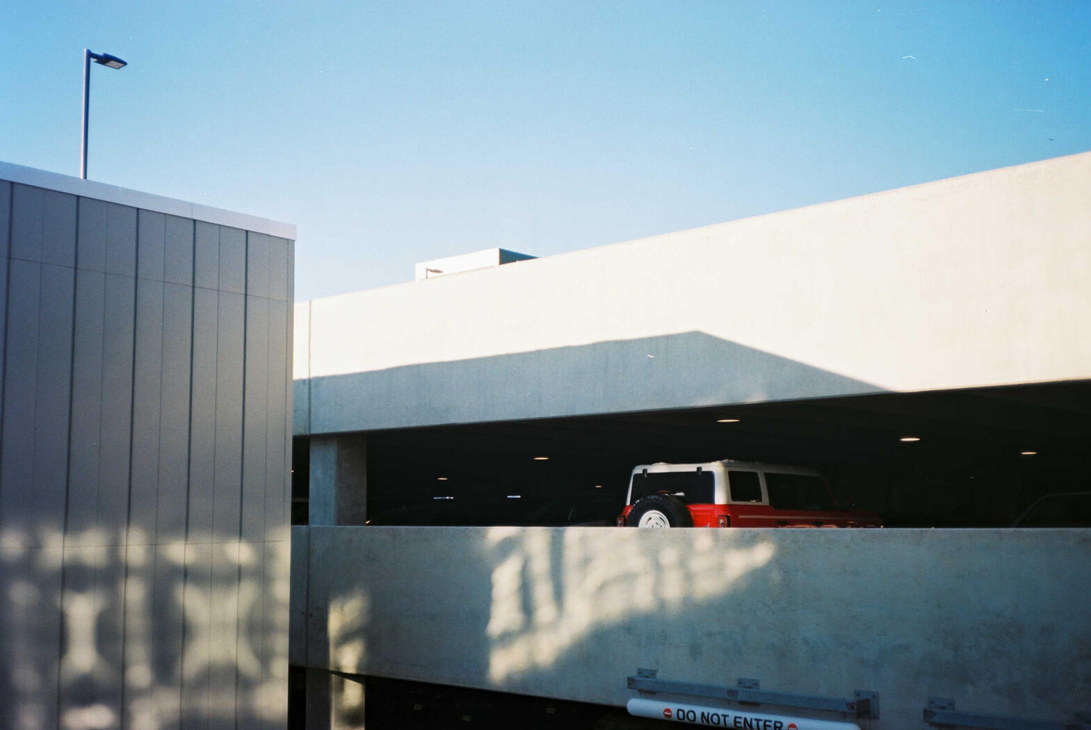 A red car parked in a garage